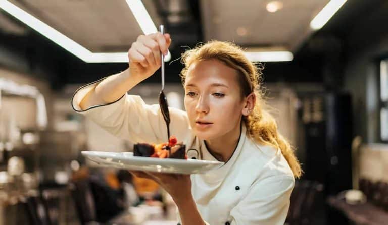 Chef plating a gourmet dish.