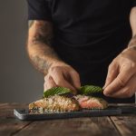 Preparing salmon with fresh leaves