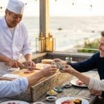 a group a of people enjoying a private sushi dinner in boston
